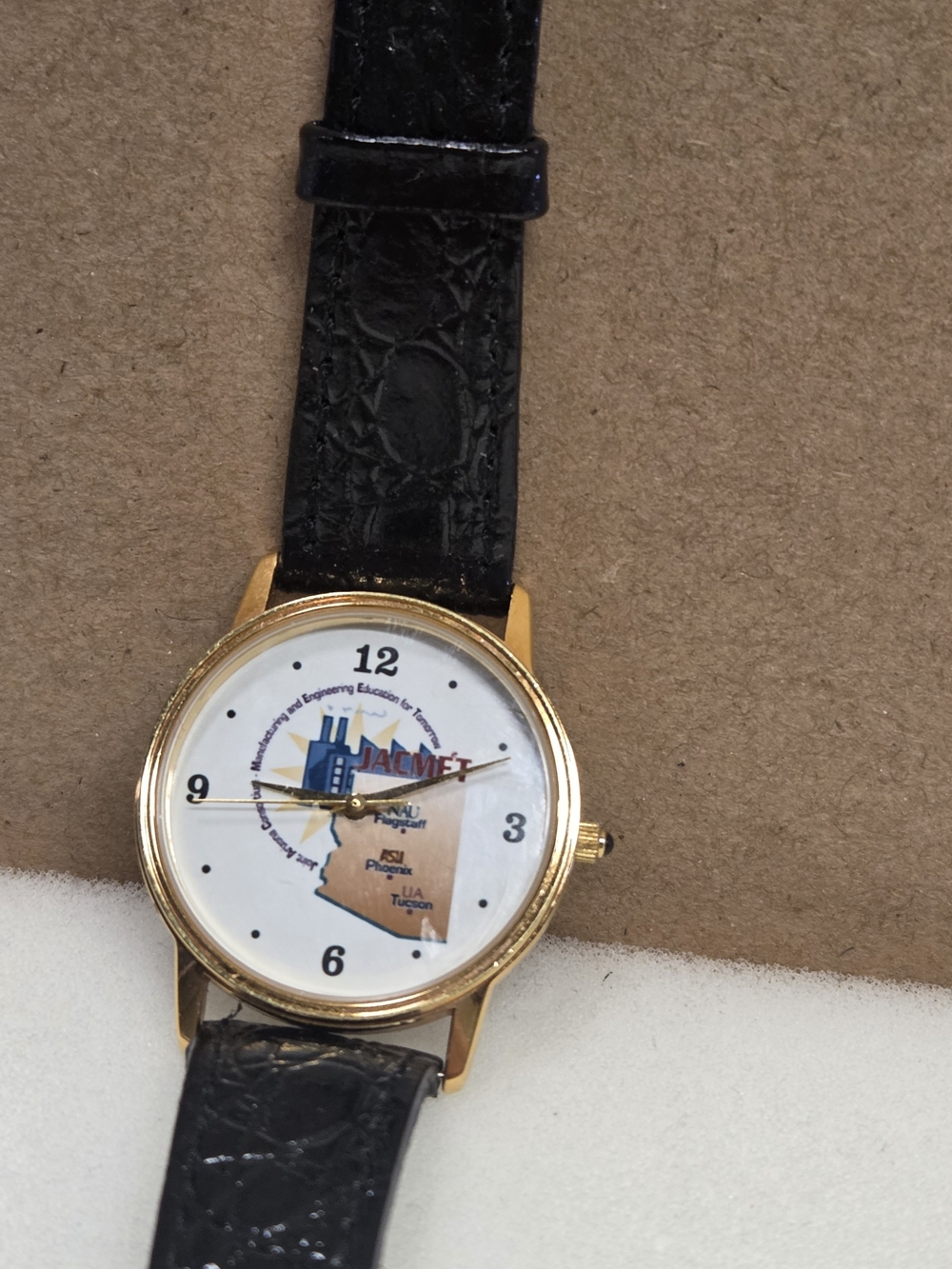 JACMET Gold-Tone Round Watch with Black Leather Strap